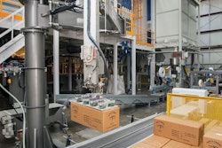 CASE PALLETIZING. In keeping with the rest of the automated line, the finished cases are automatically palletized by robot.
