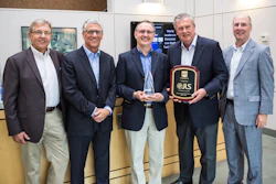 Left to right: Don Neumeister and Joe Angel of PMMI Media Group, JLS CEO Craig Souser, and Chuck Yuska and Tom Egan of PMMI.
