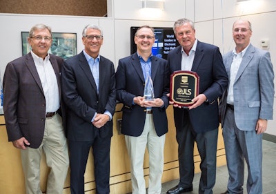 Left to right: Don Neumeister and Joe Angel of PMMI Media Group, JLS CEO Craig Souser, and Chuck Yuska and Tom Egan of PMMI.