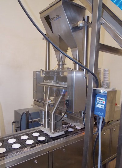 Honeyville uses a dual drop volumetric cup filler with staging gate to fill two containers at a time.