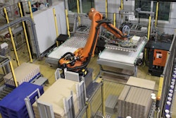 The robot handles output from two filling lines at a maximum speed of 96/hr. Tubs are gently handled with vacuum grippers as they are transferred to a trolley bound for a cooling room.
