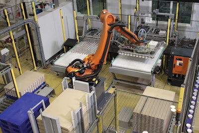 The robot handles output from two filling lines at a maximum speed of 96/hr. Tubs are gently handled with vacuum grippers as they are transferred to a trolley bound for a cooling room.