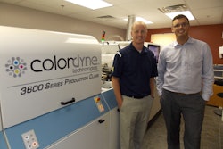 Exacto's Tom Martin (left) stands in from of his firm's new 3600 Series Laser Pro with Colordyne's Taylor Buckthorpe.