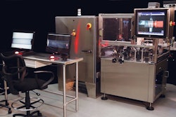 The PIL-30 particle inspection and labeling machine is shown here with a remote inspection table for two operators.