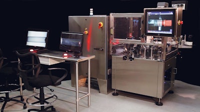 The PIL-30 particle inspection and labeling machine is shown here with a remote inspection table for two operators.