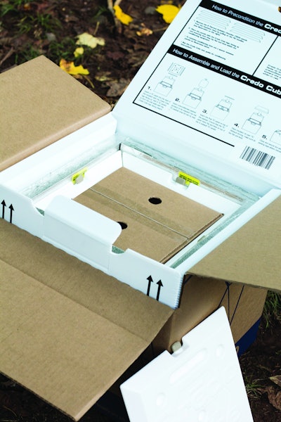 Top view of opened Credo Cube showing inner product box surrounded by interlocking TIC panels.