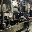 The compact InvisiPac system, shown here on the brewery’s case packer, incorporates an integrated vacuum feed, tank-free glue melter, heated hoses, glue applicators, and process control technology.