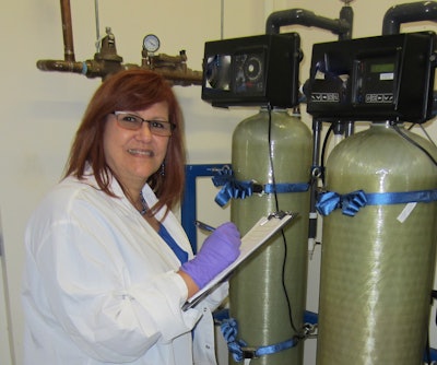 Ivette Larralde-Valdes conducts auditing of a microbiology water sample at the Purified Water System Utility area.