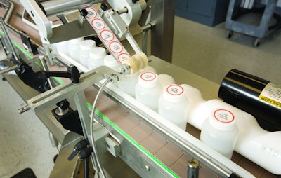 Labels are applied inline to filled and capped plastic bottles at Promega.