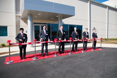 Toppan execs and local officials cut the ribbon on Toppan's new Griffin, GA, plant.