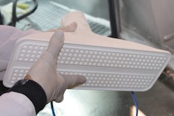 The end-of-arm tool has a Swiss cheese pattern of channels that would have been impossible to make using conventional machining techniques but was easy to accomplish with additive manufacturing.