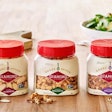 The small, square container with dual-dispensing closure lets consumers spoon or shake nuts onto their favorite foods.