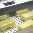 Researchers tested their milk-protein film as a packaging for blocks of cheese. Photo supplied by the American Chemical Society.