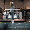 Indexing, conveying, and batch weighing systems are mechanically and electronically integrated.