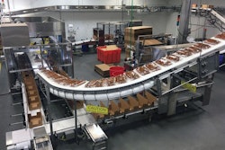 Photo A--The fully automated case packing operation—case erector, robotic case loader, and case closer.