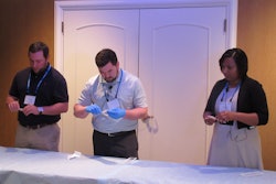 The nurses and technicians panel is an annual highlight of HealthPack. Here, thee professionals from a recent show are shown reviewing medical device packages for examination.