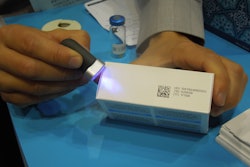 Videojet's Tim Kearns uses a UV light to read a carton code.