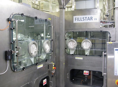 The class 100 sterile chamber of the aseptic filler can be accessed through the glove ports.