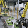 A robotic palletizer and stretch wrapper reside at the end of the line.