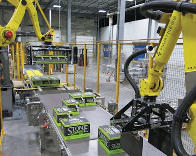 A robotic palletizer and stretch wrapper reside at the end of the line.