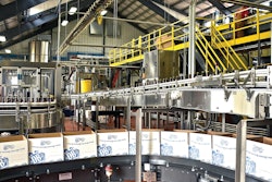 A high-level depalletizer single files and feeds bottles into a lowerator on their way down the line. Many of the equipment suppliers represented in the line are located near the brewery’s Richmond, VA, location.