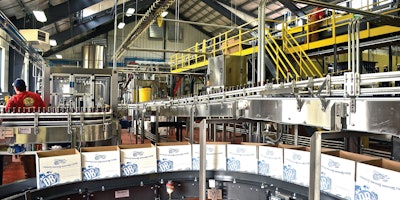 A high-level depalletizer single files and feeds bottles into a lowerator on their way down the line. Many of the equipment suppliers represented in the line are located near the brewery’s Richmond, VA, location.