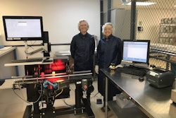 Afton Scientific’s Kari Moore (left) and Ashley Umberger stand beside the packaging line where the serialization equipment is seen on the conveyor, with the aggregation equipment on the tabletop.