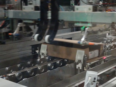 A gantry robot wraps the corrugated around the order.