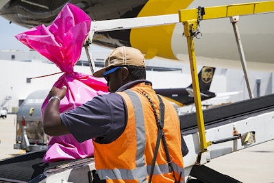 This photo shows packaged organs being loaded onto a UPS browntail.