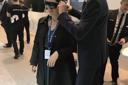 Keren Sookne, Director of Content for Healthcare Packaging, gets fitted for an 'augmented reality' tour in the Pester booth here at Interpack in Düsseldorf.