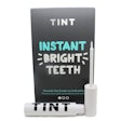 TINT is packaged in a lipgloss-style pack that lets users brush the whitener onto their teeth.
