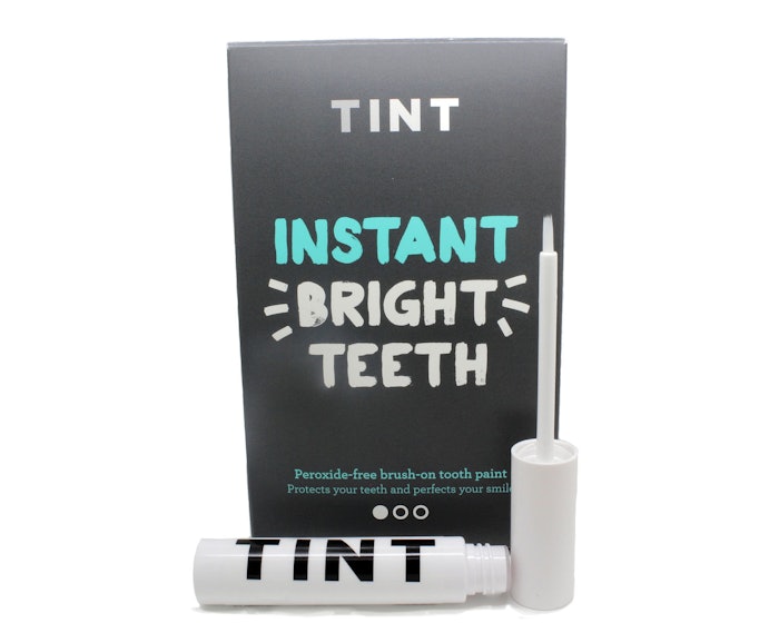 TINT is packaged in a lipgloss-style pack that lets users brush the whitener onto their teeth.
