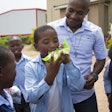 Once schoolchildren had eaten their FUTURELIFE Smart food meals, they helped collect the pouches.