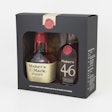 A gift pack for Maker’s Mark bourbon whisky features a wood-grained insert, a paper strip stamp, and a wax seal.