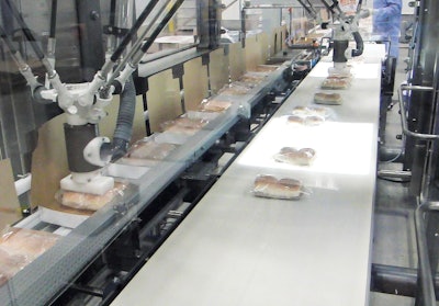Flow-wrapped two-count pillow packs of burgers are vacuum-picked and placed into top-load chipboard cartons.