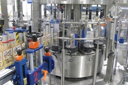 Located just ahead of the cleaner/filler/capper block on Line B, this pressure-sensitive labeler applies front, back, and neck labels if required.