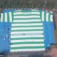 The T-shirt measures approximately 320 feet high by 230 feet wide and is made from 200,000 recycled PET bottles.