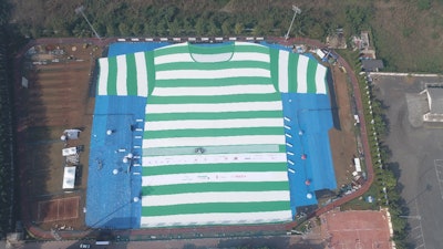 The T-shirt measures approximately 320 feet high by 230 feet wide and is made from 200,000 recycled PET bottles.