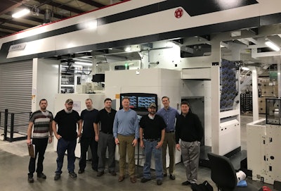 The Kendall Team in front of their new MIRAFLEX II A (l to r) Kenny Stephens (Material Handler), Jayson Brazda (Press Operator), Joe Williams (Assistant Press Operator), Jack Trostle (Pittsbrug Plant Manager), Eric Erickson (CEO/President), Jerry Newport (Assistant Press Operator), Russell Schneider (COO) and Michael Sallmann (CFO).