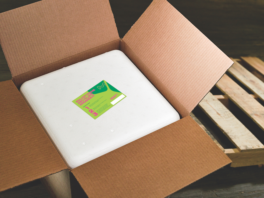 A MilliporeSigma cooler is shown with the cooler return label on top of the cooler lid. This label shows the procedure for shipping the cooler back to MilliporeSigma.