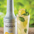 Monin purees are available in 1-L, silver-colored, HDPE bottles that feature a long, textured, neck. The bottle's function has b