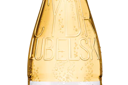 Popular beverage in Poland gains a new look while also reducing bottle weight by about 10%.