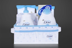 The custom-made gift basket holds a number of baby bath products as well as a winged, dove-shaped towel.