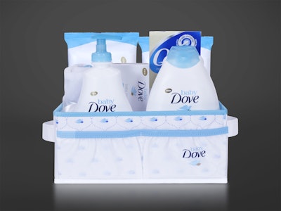 The custom-made gift basket holds a number of baby bath products as well as a winged, dove-shaped towel.