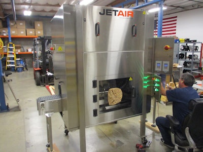 THe JetAir DL 1500 dryer system boasts an integrated dynamic hold-down feature.
