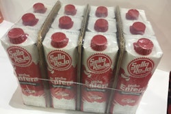 12-pack cases of capped 1-L milk cartons use inserted corrugated in a shrink bundle instead of a corrugated case.