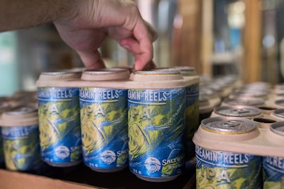 Company is reportedly the first to use the environmentally friendly E6PR ring. Made of barley and wheat ribbons used in the brewing process, it also provides the strength to hold cans through distribution.