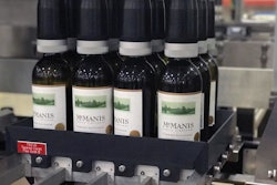 Bottles being inserted into case at McManis Family Winery.