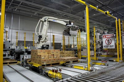 A six-axis robotic palletizer at California Dairies can handle cases of butter up to 50 lb from four packaging lines at one time.