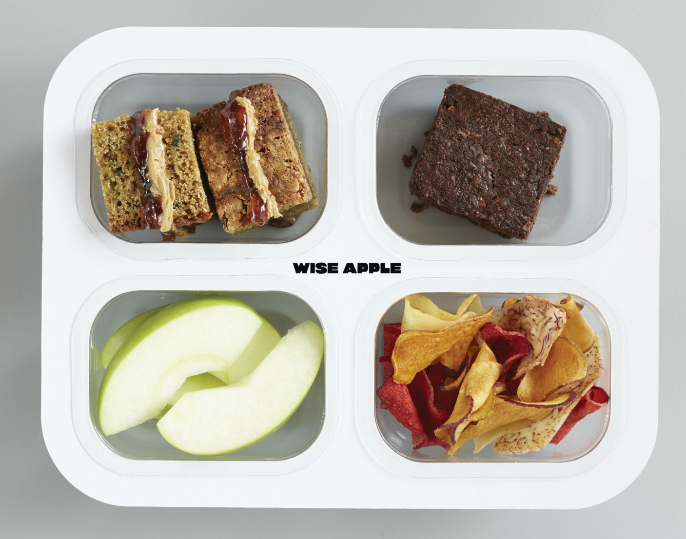 Four thermoformed &lsquo;pods&rsquo; snap into each paperboard tray.